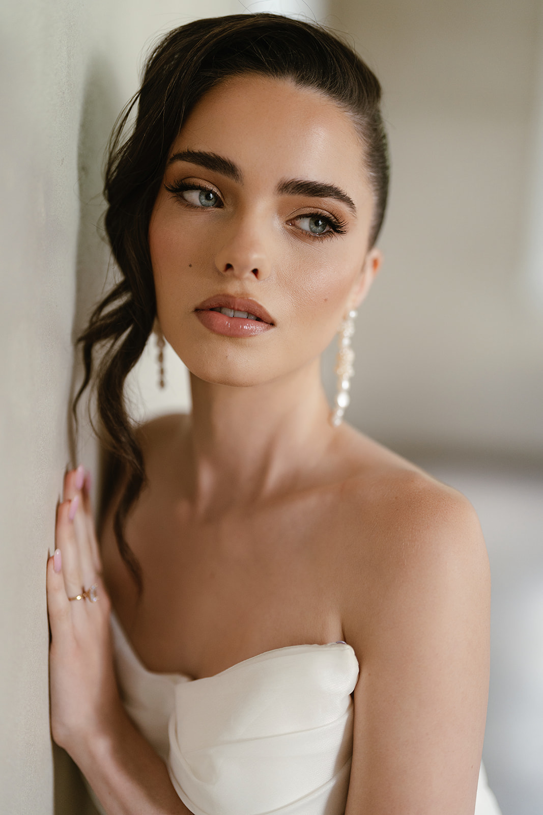 Close up of bride with beautiful glowy glam makeup and hair