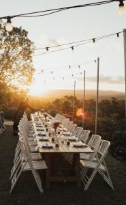 Sunshine Coast wedding coordinator Jacqueline from Wild Heart Weddings on the job setting up a reception table - Q&A with bridal blog The Bride's Tree