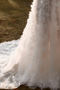 close up of bridal gown design features with 3D lace on Anna Campbell wedding dress