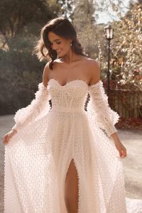 bride wearing new bridal gown from Anna Campbell bridal collection Bloom 2024