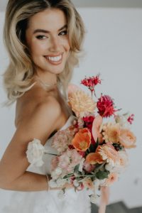 Bride with beautiful wedding hair and makeup by Sunshine Coast wedding makeup artist and hair stylists