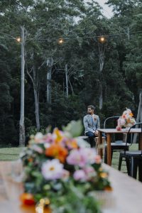 groom seated at outdoor wedding ceremony at a private property wedding on the Sunshine Coast for bridal blog The Bride's Tree