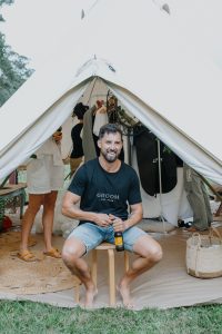 Groom wearing wedding day "groom" tee