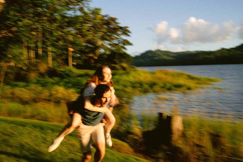 Young couple in love by the Lake for cute engagement shoot