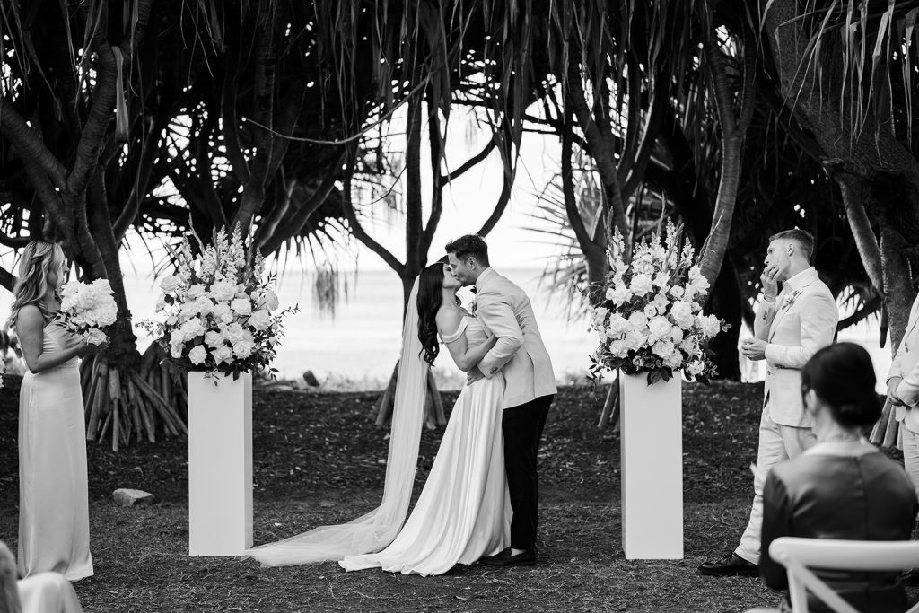 Bride and groom have their first kiss at Noosa Wedding Ceremony 