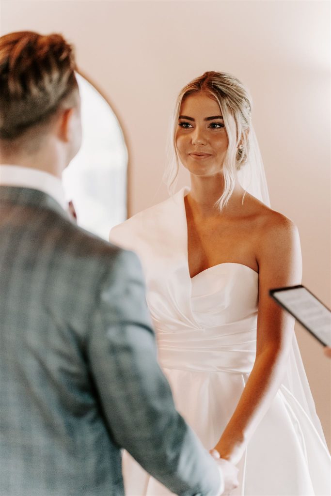 Bride looking radiant at wedding ceremony on the Sunshine Coast with fresh natural dewy bridal makeup by local makeup artist specialising in weddings Natalie Hunter makeup artist