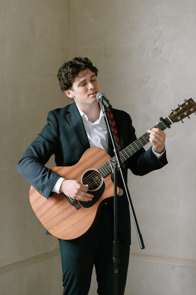 Sunshine Coast wedding musician Harry Morris playing his accoustic guitar and singing