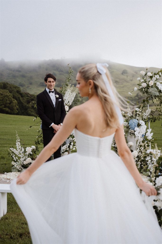 Bride walking down the aisle towards her groom in Maleny wedding 