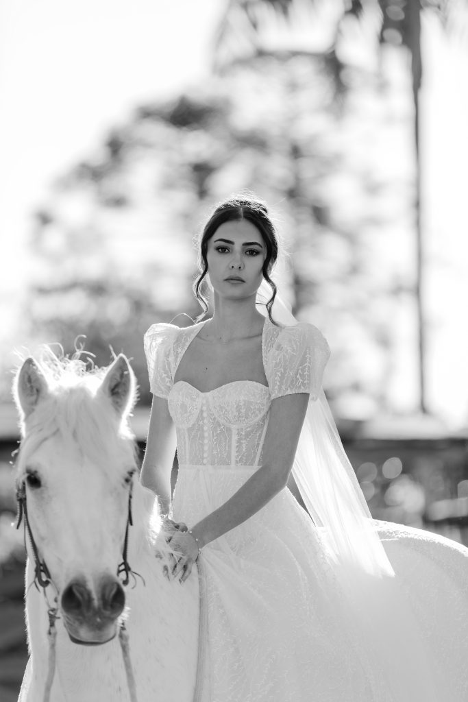 bride on white horse at Yandina Station wedding venue 