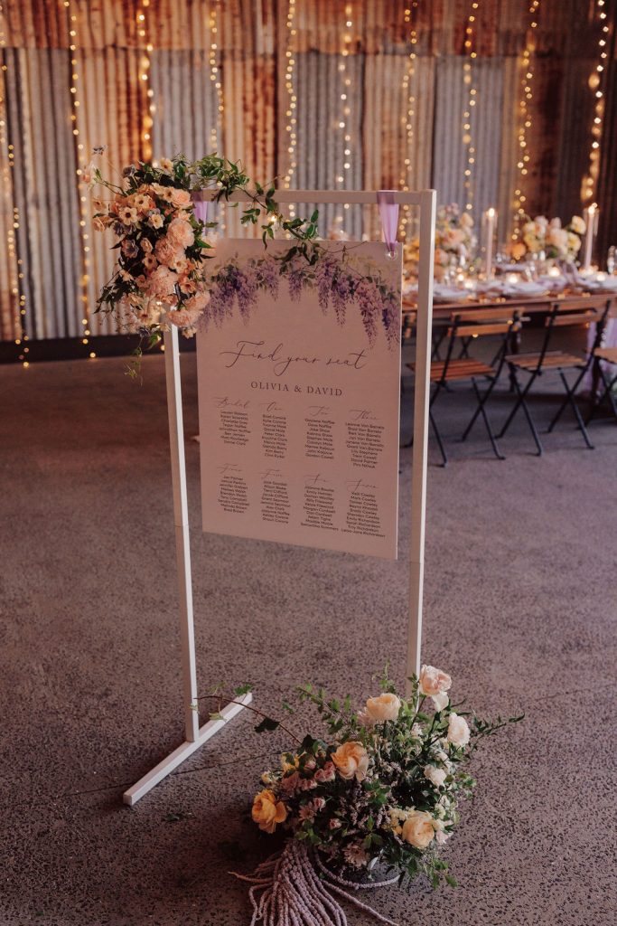 wedding reception seating chart in frame Cloud Nine Weddings stylist sunshine coast