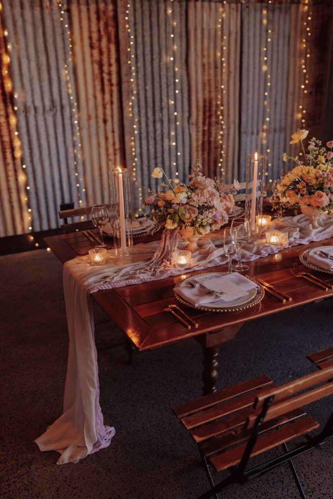 reception tablescape in twilight with draping fabrics and candles lavender theme wedding sunshine coast country wedding venue 